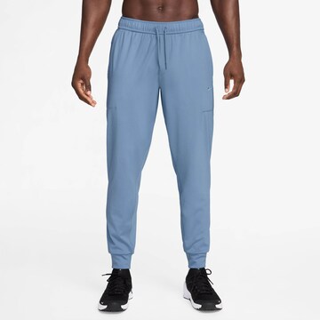 NIKE Tapered Workout Pants in Blue: front