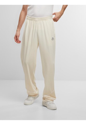 Loosefit Pantalon de sport ' ' Karl Kani en beige : devant