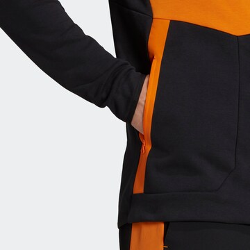 ADIDAS SPORTSWEAR - Sudadera con cremallera deportiva en naranja