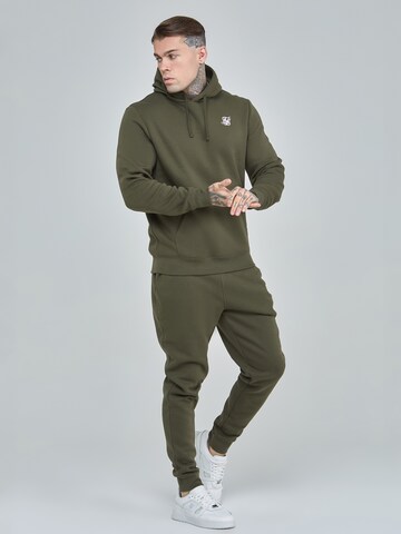 SikSilk Flared Sporthose in Grün