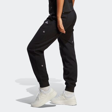 ADIDAS SPORTSWEAR Tapered Sports trousers 'Healing Crystals Inspired Graphics' in Black