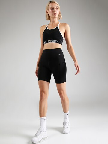 Skinny Pantaloni sport de la NIKE pe negru