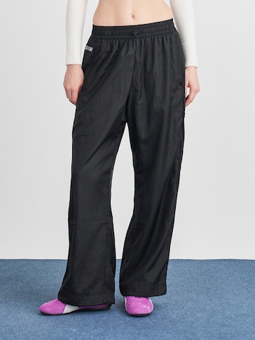 PUMA Wide leg Workout Pants 'Puma x Rose' in Black