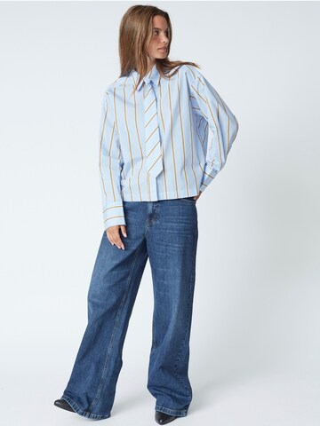 Chemisier 'Amora' co'couture en bleu
