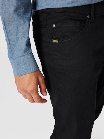 Slimfit Jeans 'EVOLVE' di Tiger of Sweden in nero