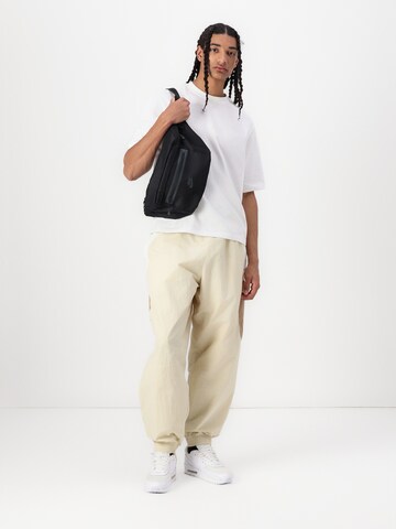 Nike Sportswear Baggy Kalhoty 'CLUB' – zelená