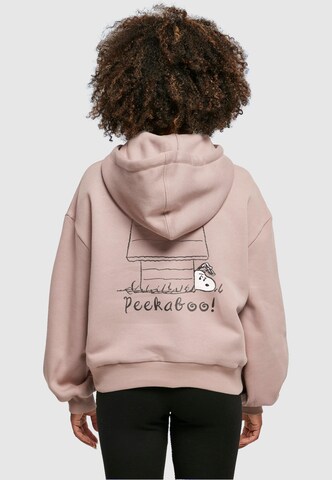 Merchcode Sweatshirt 'Peanuts - Peekaboo' in Pink: Vorderseite