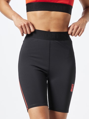 PUMA Skinny Spodnie sportowe 'x Vogue Collection' w kolorze czarny