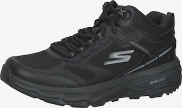 Baskets basses SKECHERS en noir : devant