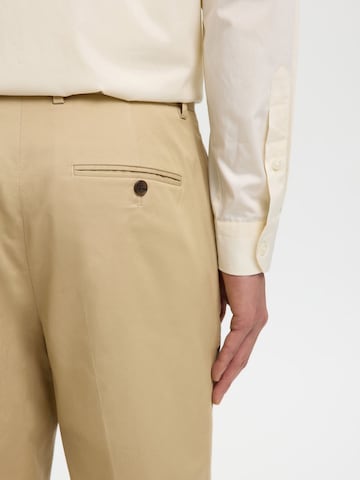 SELECTED - regular Pantalón de pinzas en beige