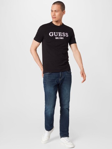 GUESS T-Shirt 'POINT' in Schwarz