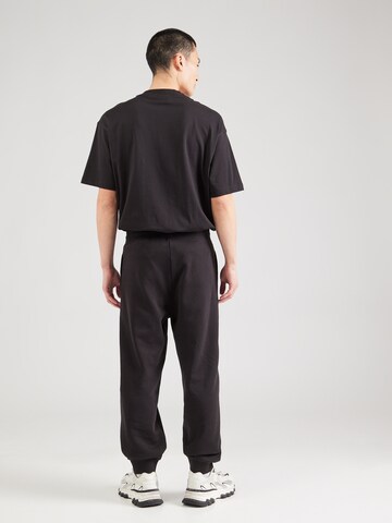 Tapered Pantaloni 'Noiderpant' di HUGO in nero