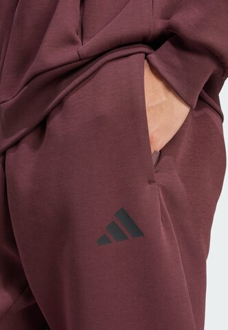 ADIDAS SPORTSWEAR Tapered Sports trousers 'Future Icons' in Red