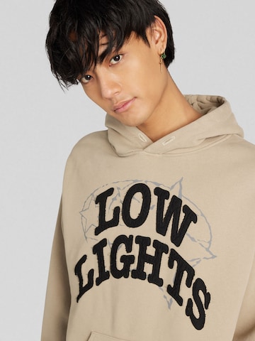 Low Lights StudiosSweater majica 'World-Race' - bež boja
