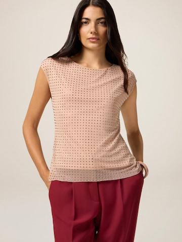 Top di oltre in rosa