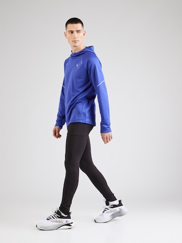 PUMA Spordidressipluusid 'Run Grid', värv sinine