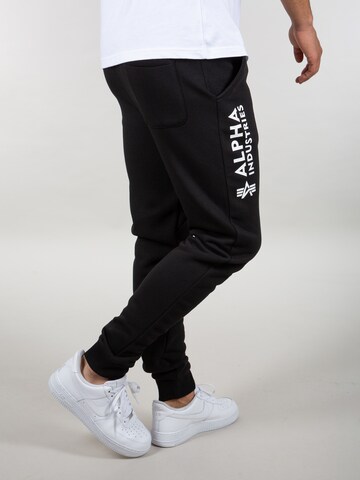 ALPHA INDUSTRIES Tapered Pants in Black