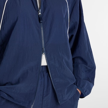 new balance Sports jacket 'Sport Legacy Jacket' in Blue