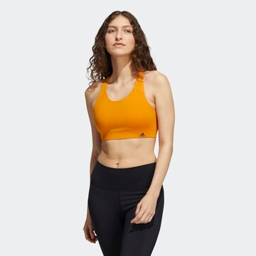 Bustino Reggiseno sportivo di ADIDAS SPORTSWEAR in arancione: frontale