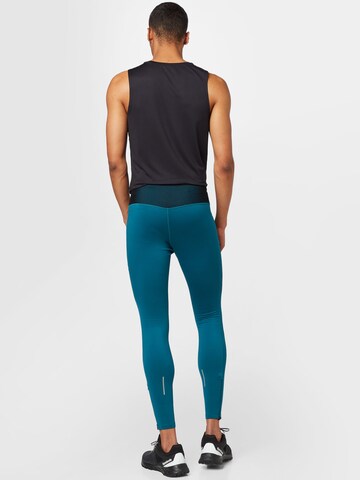 ASICS Skinny Sportovní kalhoty – modrá