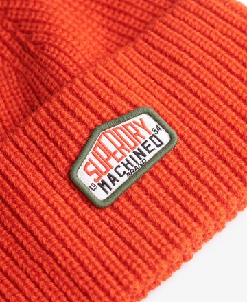 Superdry Muts in Oranje