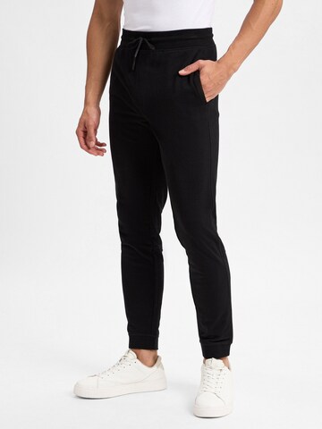 Nils Sundström Slim fit Trousers in Black: front