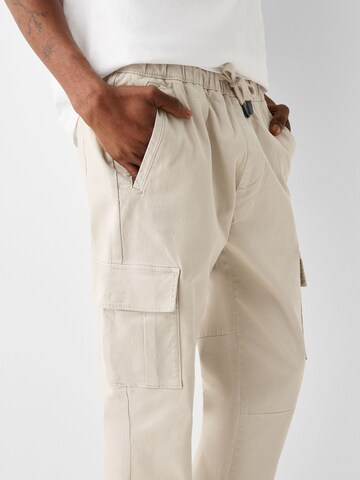 Bershka Tapered Hose in Beige