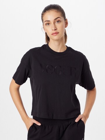 PUMA Performance shirt 'PUMA x Vogue Collection' in Black: front