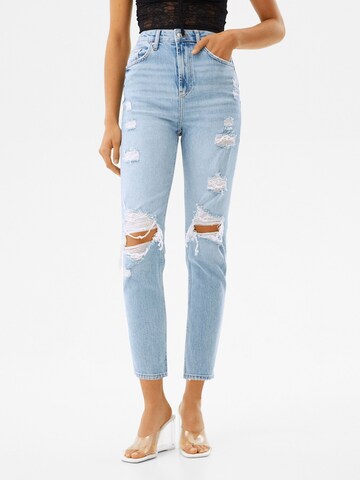 Bershka Tapered Jeans in Blue: front