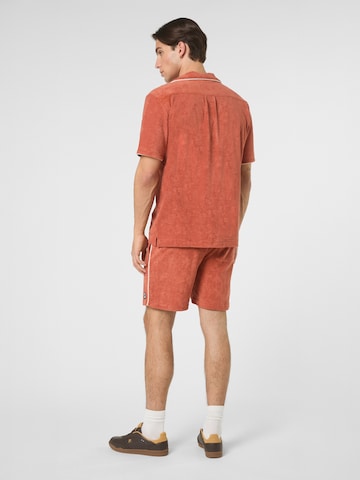 regular Pantaloni 'EMPOLI regular towelling shorts' di FILA in rosso