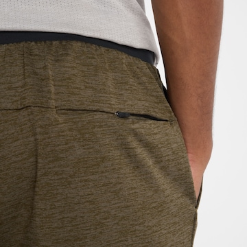 new balance Tapered Sportbroek in Groen