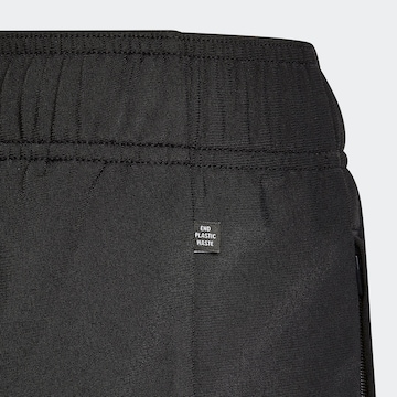 ADIDAS ORIGINALS Tapered Housut 'Tracksuit Bottoms' värissä musta