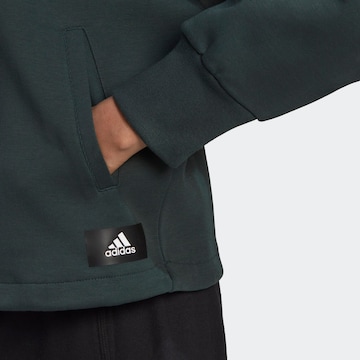 ADIDAS SPORTSWEAR Sportief sweatshirt 'Future Icons Badge Of Sport Sport ' in Groen