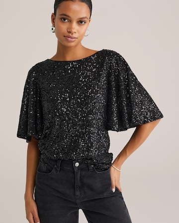 Top de la WE Fashion pe negru: față