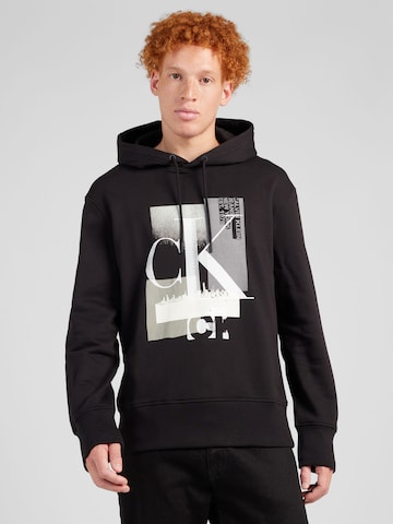 Sweat-shirt Calvin Klein Jeans en noir : devant