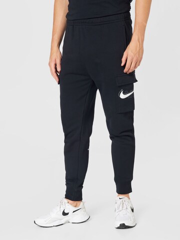 Nike Sportswear Tapered Cargo trousers in Black: front