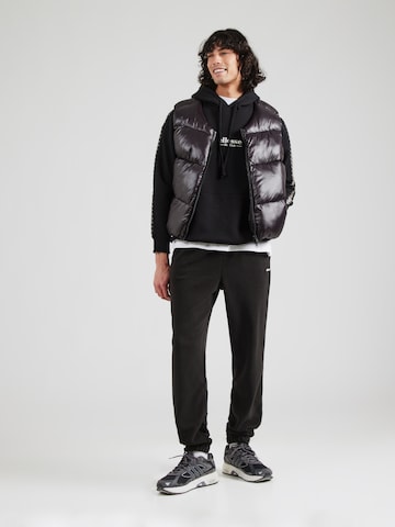 ELLESSE Tapered Broek 'Cache' in Zwart