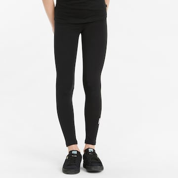 PUMA Skinny Leggingsit 'ESS+' värissä musta: edessä