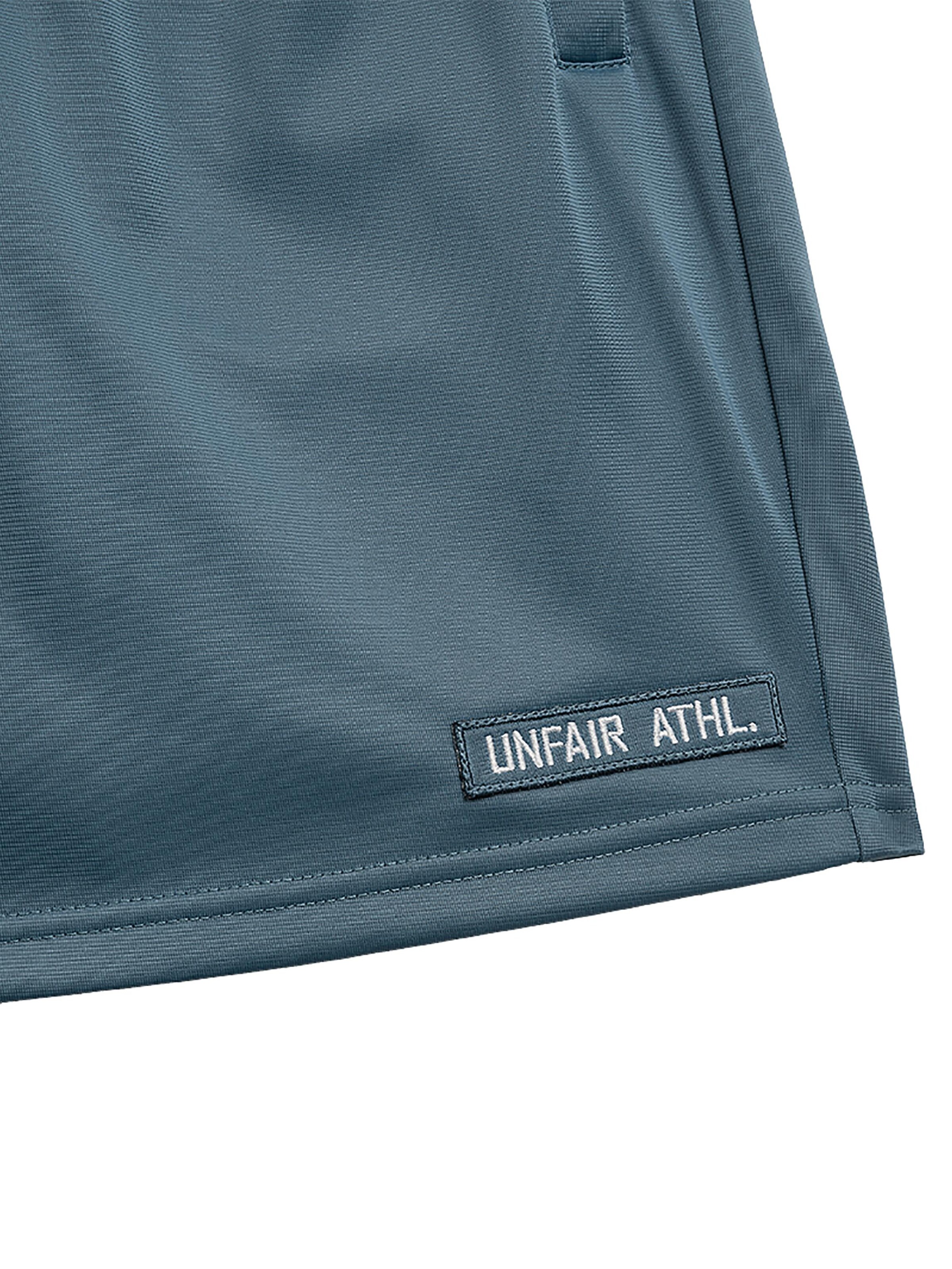 Loosefit Pantalon de sport 'Athletic DMWU' Unfair Athletics en bleu