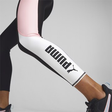 PUMA Skinny Sports trousers in Black