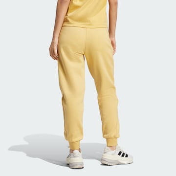 Effilé Pantalon de sport 'Z.N.E.' ADIDAS SPORTSWEAR en jaune