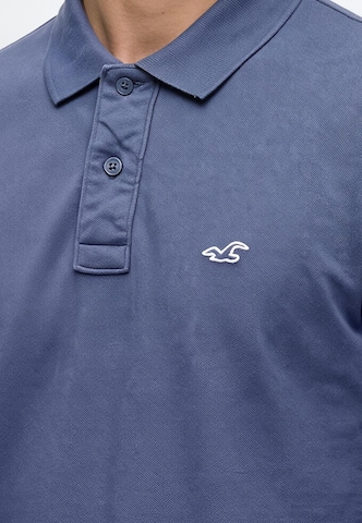 Tricou 'JUL4 INTL EXCLUSIVE' de la HOLLISTER pe albastru