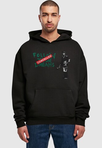 Merchcode Sweatshirt 'Follow Your Dreams' in Black: front