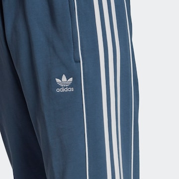 ADIDAS ORIGINALS Zwężany krój Spodnie 'Rekive' w kolorze niebieski