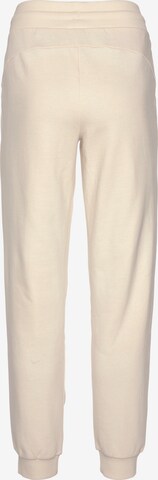 PUMA Tapered Workout Pants 'Better' in Beige