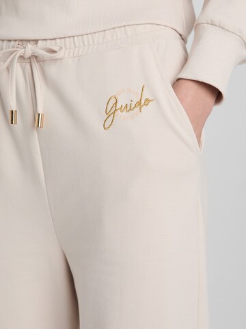Guido Maria Kretschmer Women Voľný strih Nohavice 'Georgina' - Béžová