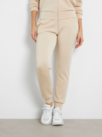 GUESS Regular Workout Pants in Beige