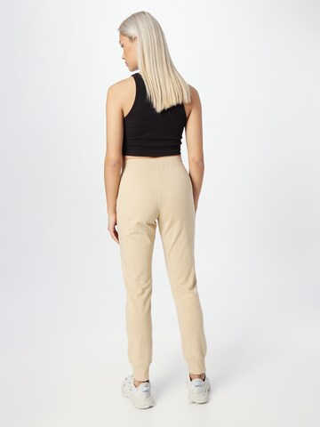 Champion Authentic Athletic Apparel Tapered Broek in Bruin
