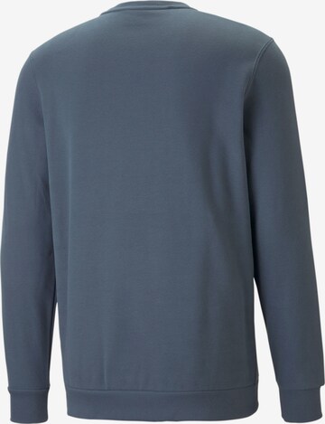 PUMA Sportsweatshirt 'Elevated' in Blauw