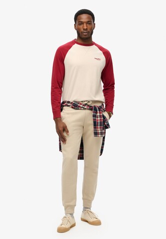 Superdry Regular Hose 'ESSENTIAL' in Beige